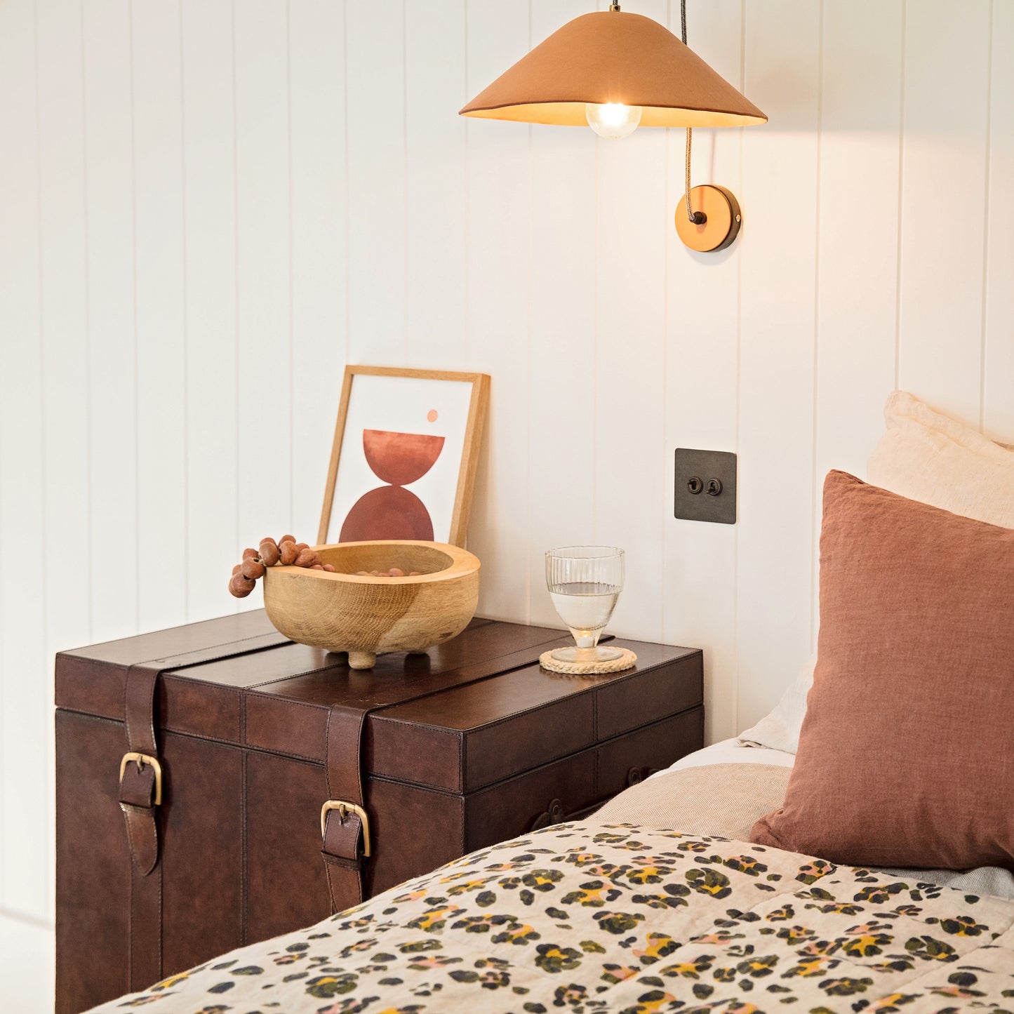 Timeless tan leather storage trunk ottoman with a lid and buckles. Use as a bedside table and personalise to create a wedding day gift to treasure forever.