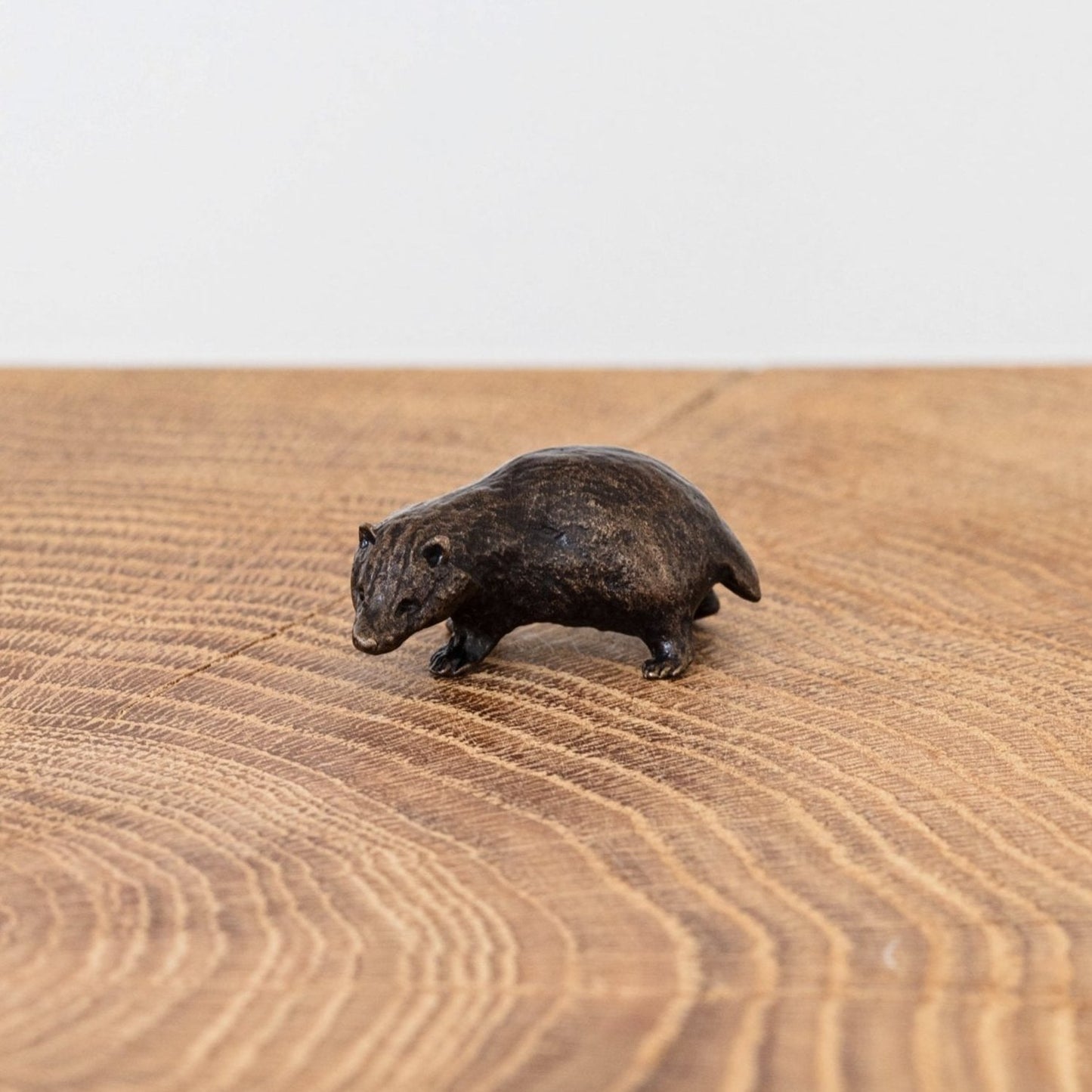 Miniature bronze figurine of a badger. Ideal as a bronze anniversary gift or thoughtful birthday gift.