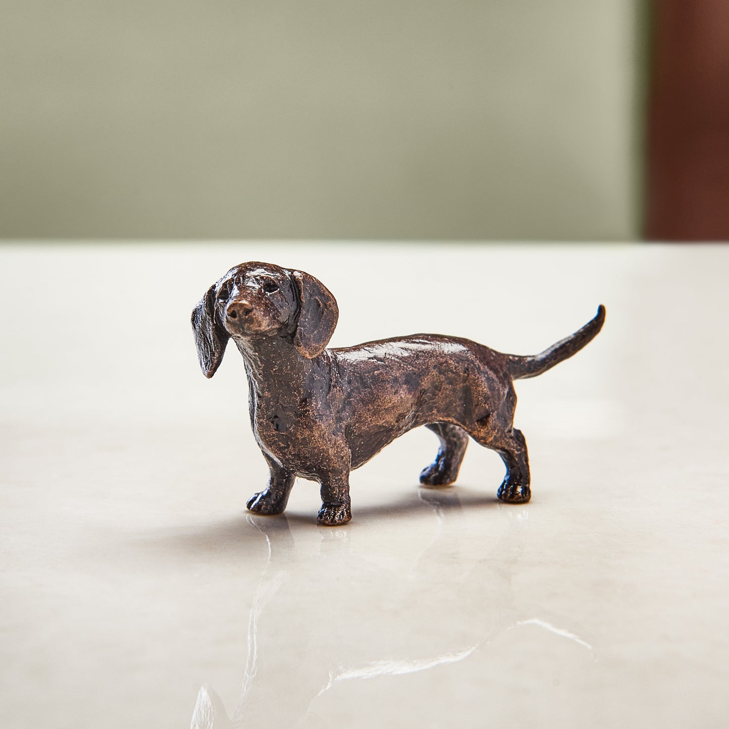 
                  
                    Miniature bronze figurine of a dachshund. A thoughtful bronze anniversary gift or birthday gift for dog lovers.
                  
                