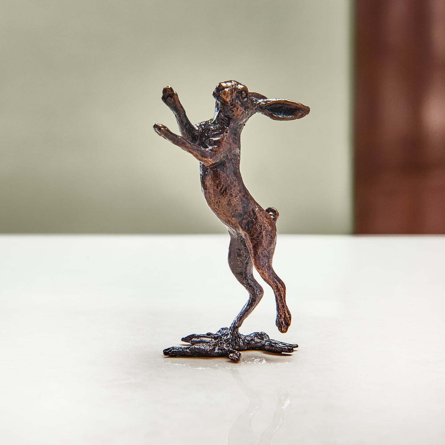 Miniature bronze figurine of a boxing hare. Give as a bronze anniversary gift or thoughtful birthday gift.