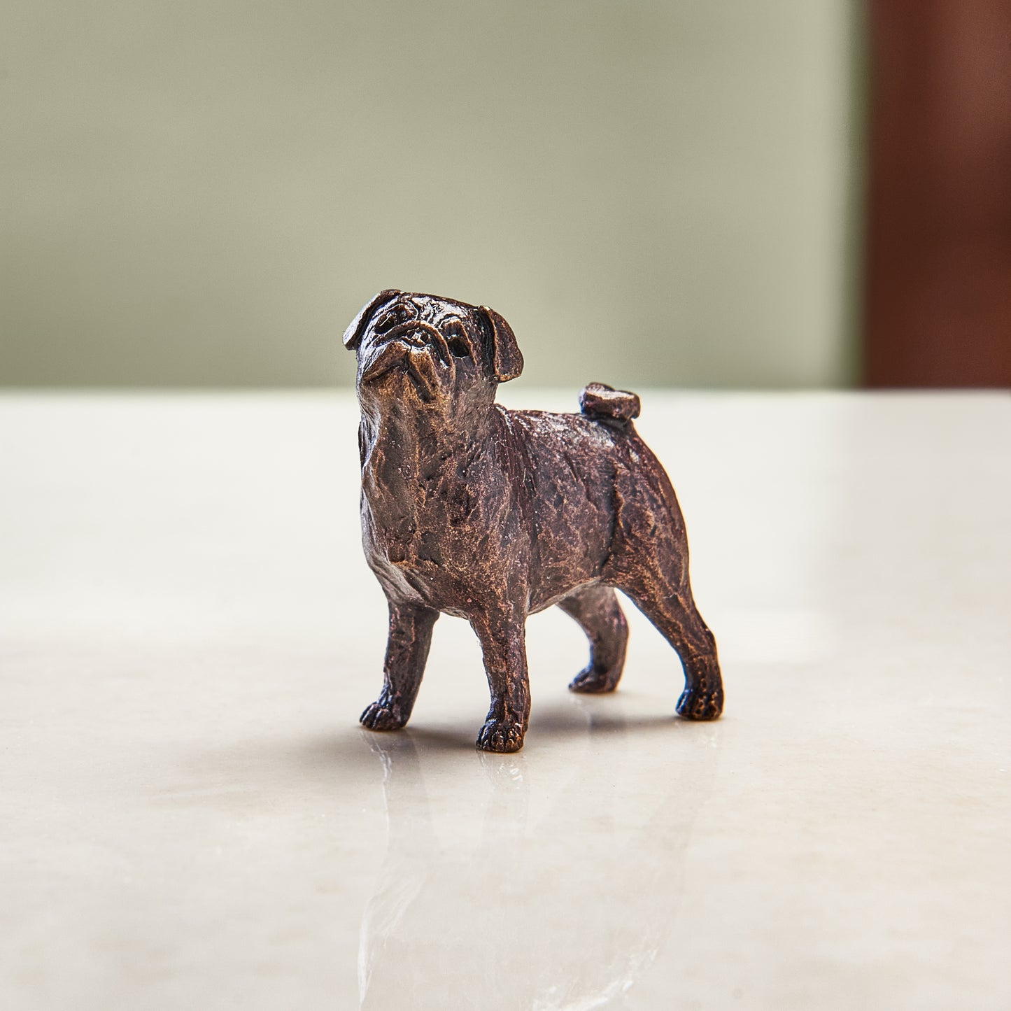 Miniature bronze figurine of a pug. A thoughtful bronze anniversary gift for him or her.