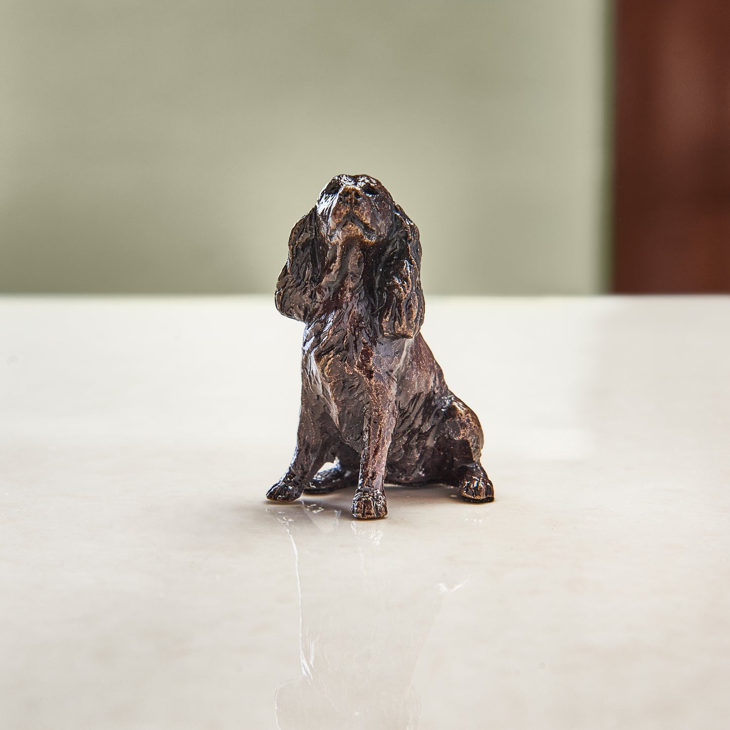 Miniature bronze figurine of a spaniel. A thoughtful bronze anniversary gift for him or her.