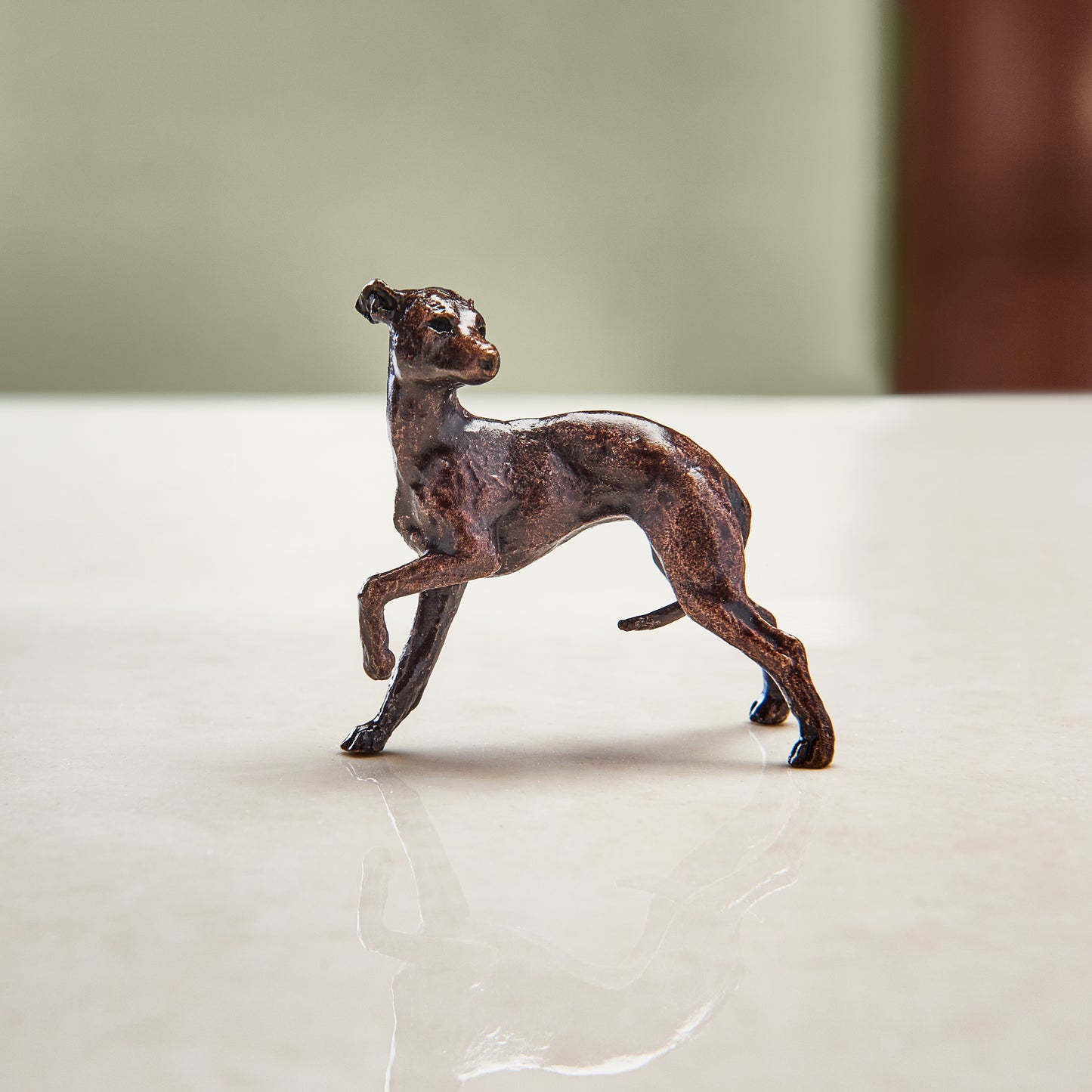 Miniature bronze figurine of a whippet. A thoughtful bronze anniversary gift or birthday gift for dog lovers.