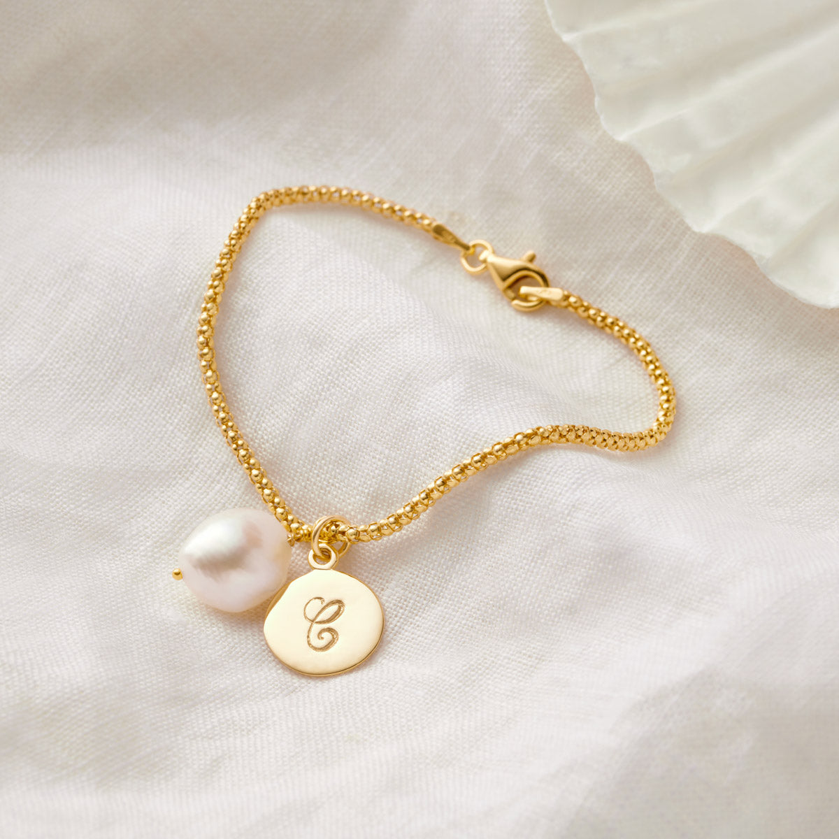 
                  
                    Gold Initial Disc Bracelet With Freshwater Pearl
                  
                