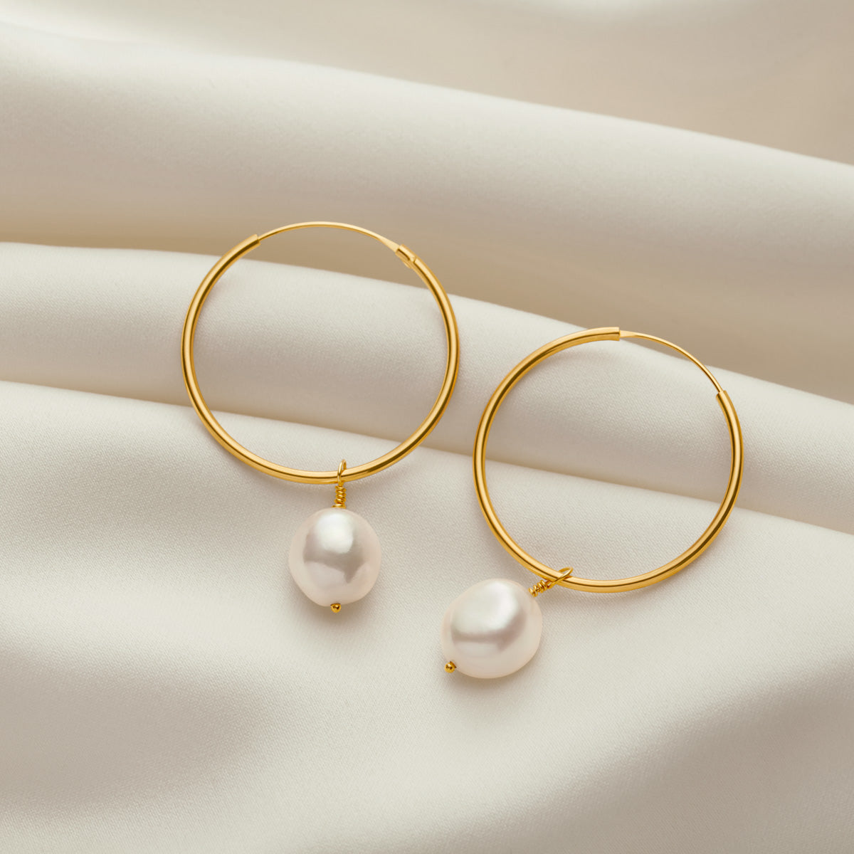 
                  
                    Large Gold Hoop Earrings With White Freshwater Pearls
                  
                