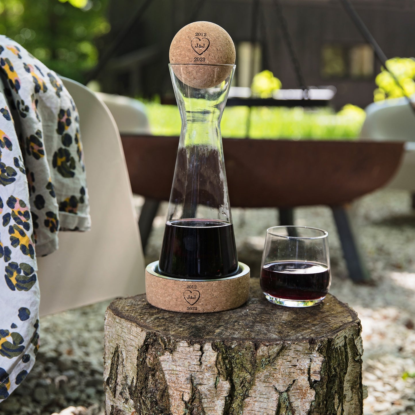Glass carafe with cork stopper and steel and cork wine coaster to protect surfaces from drips. Add a name or design to create a personalised 11th anniversary gift.