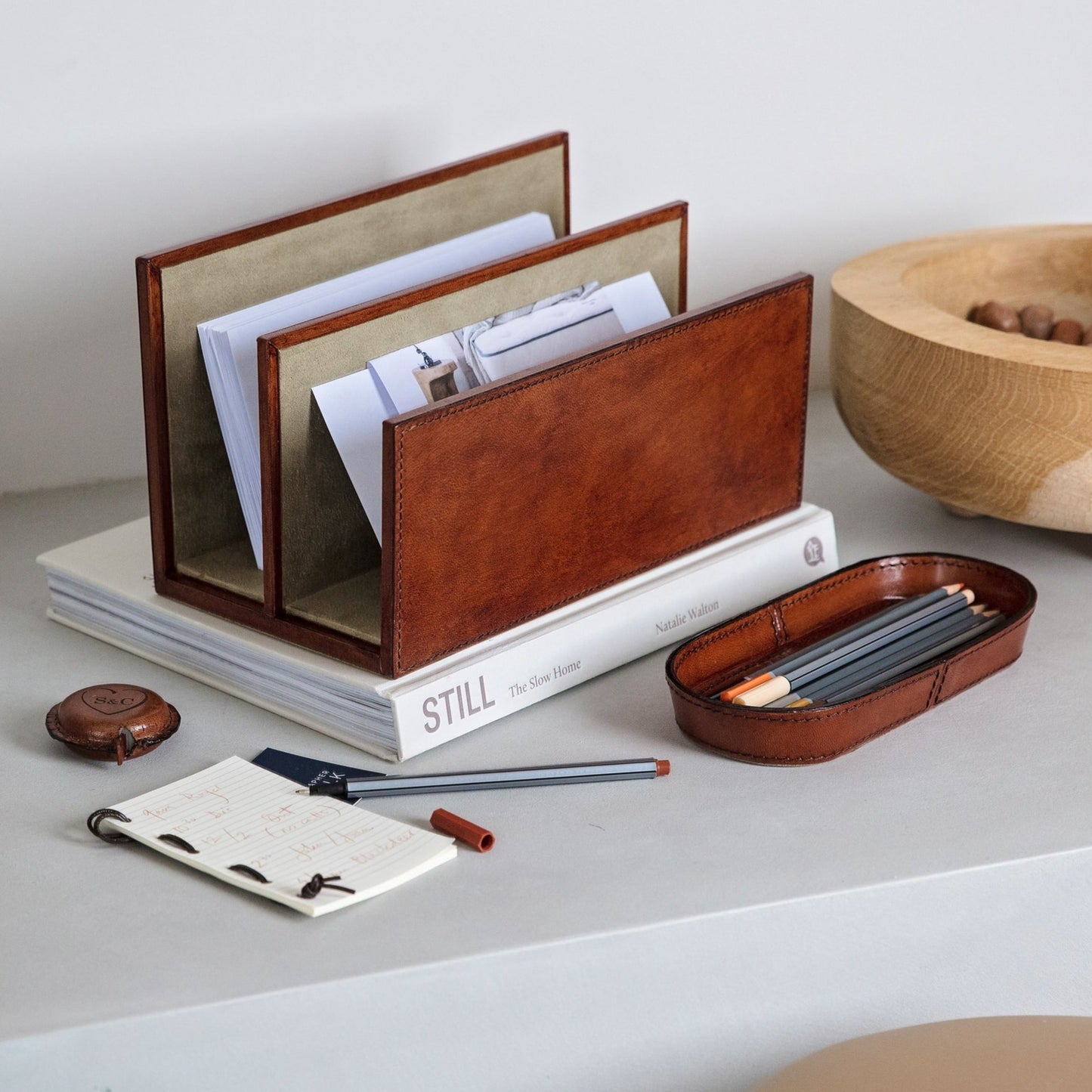 A thoughtful and unique gift for a new home or to celebrate retirement, this trio of letter rack, pen tray and personalised leather tape measure is classic, stylish and practical.