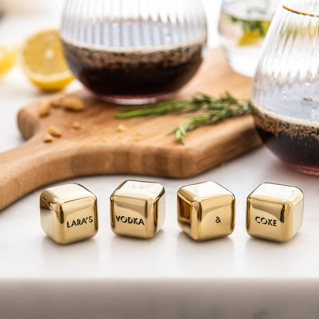Set of four personalised gold finish stainless steel ice cubes. Add initials, names or dates to create a thoughtful Mother’s Day or Christmas gift.