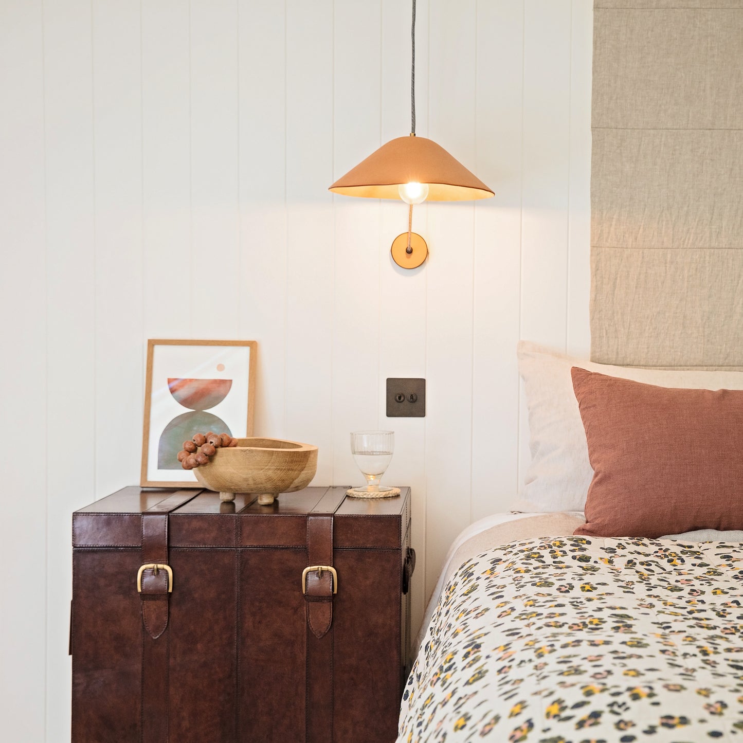 Timeless tan leather storage trunk ottoman with a lid and buckles. Use as a bedside table and personalise to create a wedding day gift to treasure forever.
