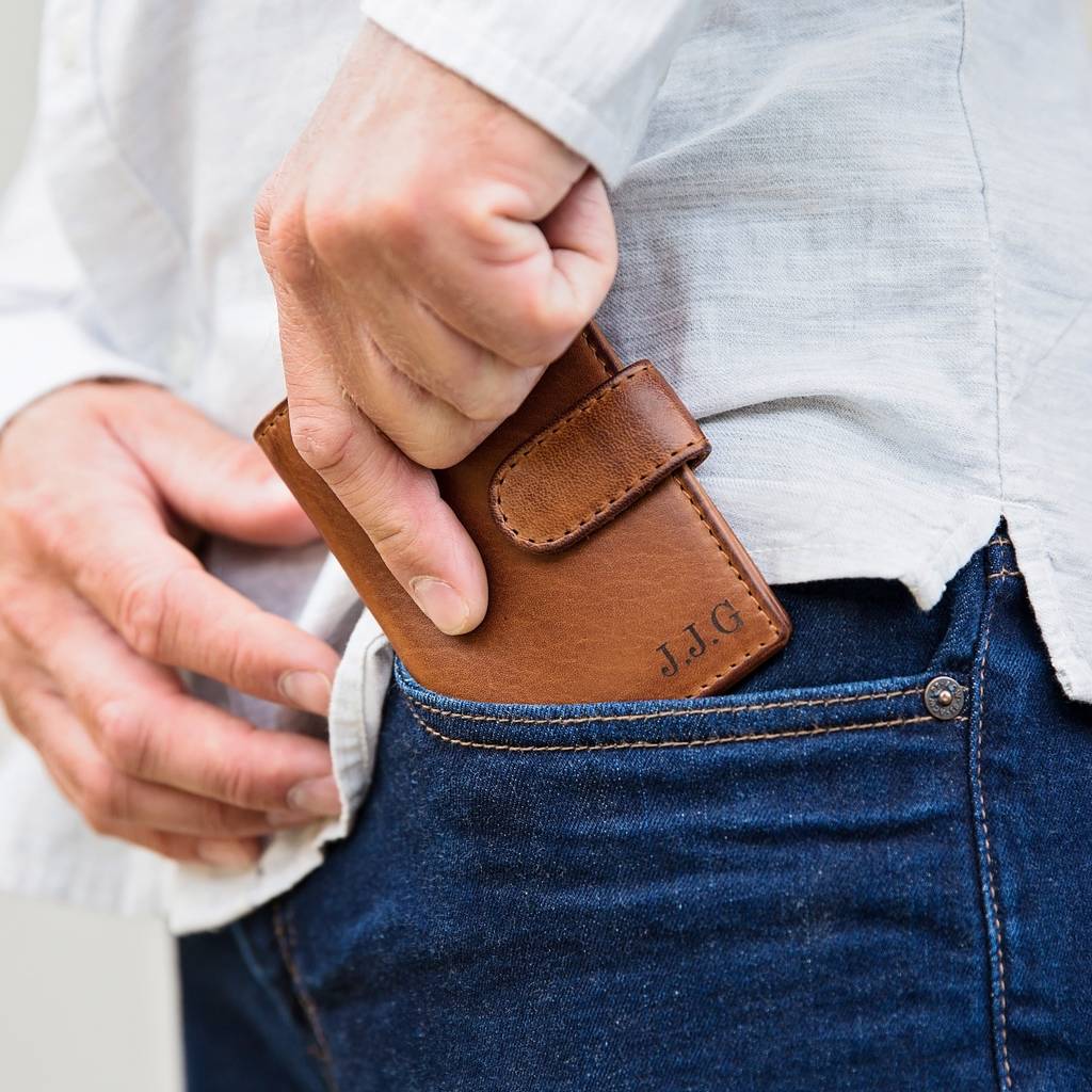 Personalised leather card wallet in soft tan leather, opens up with space for cards and notes and folds in half to close with a secure strap and press stud. Add initials or a message inside for an 18th birthday gift or unique father’s day gift.