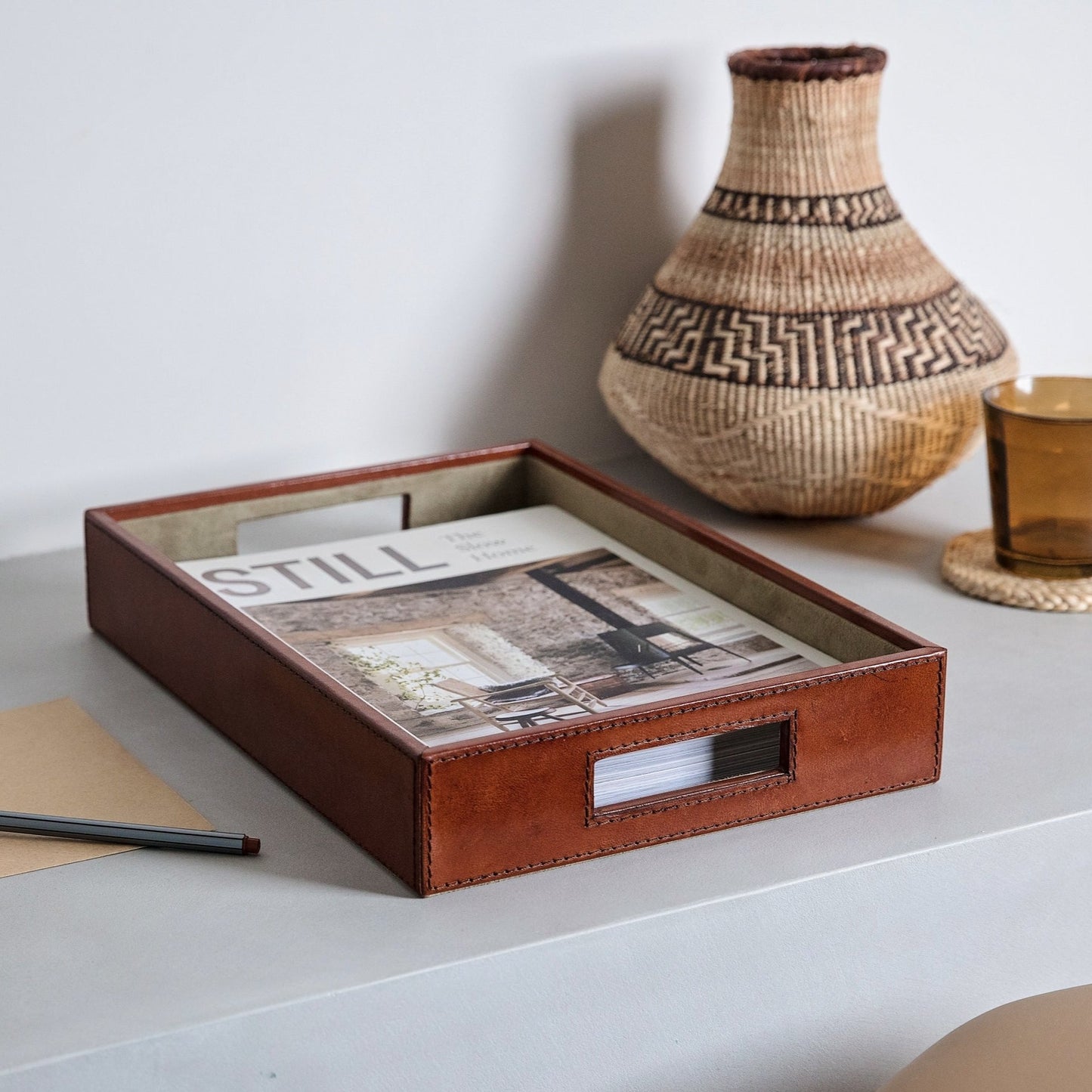 
                  
                    Tan leather desk tray to keep paperwork tidy in the office or home. Part of a collection of stylish desk accessories that make a thoughtful gift for the him or her.
                  
                