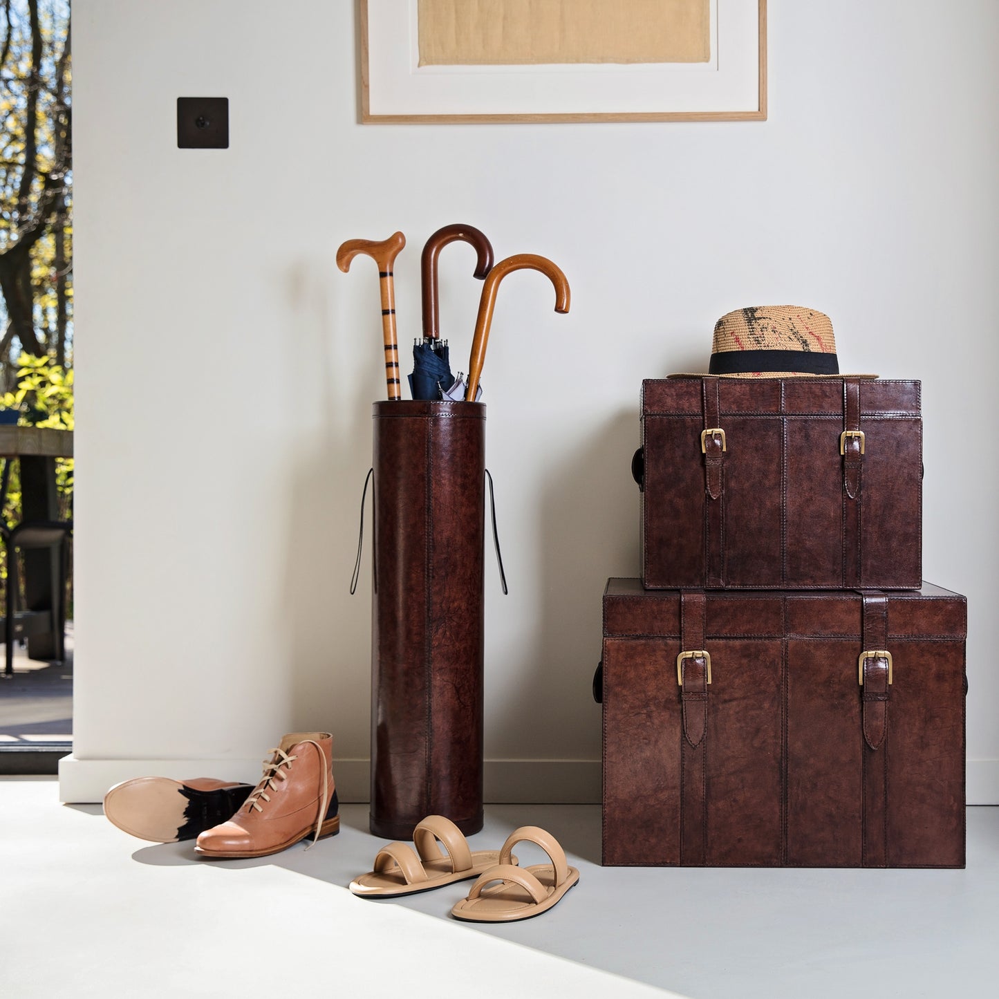 Set of rich brown leather storage trunks in three sizes with lids and buckles. A timeless heirloom gift for the home or a wedding day gift to treasure forever.