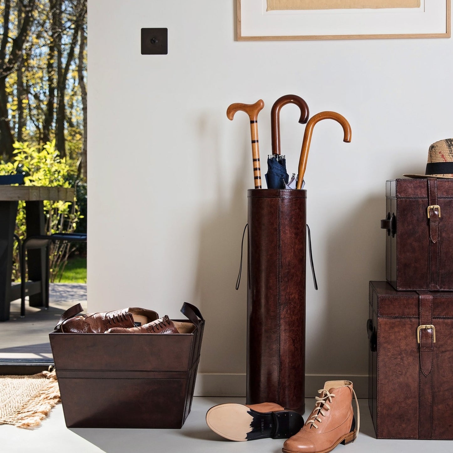 Hallway storage set combining our brown leather stick stand and storage basket. Both have sturdy handles for moving around and have a suede lining. Gift to a happy couple on their third anniversary.