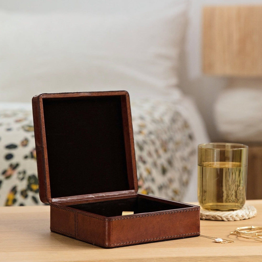 Square leather jewellery box in tan, to hold necklaces, earrings and rings. Personalise as a timeless gift for an 18th birthday or wedding anniversary.