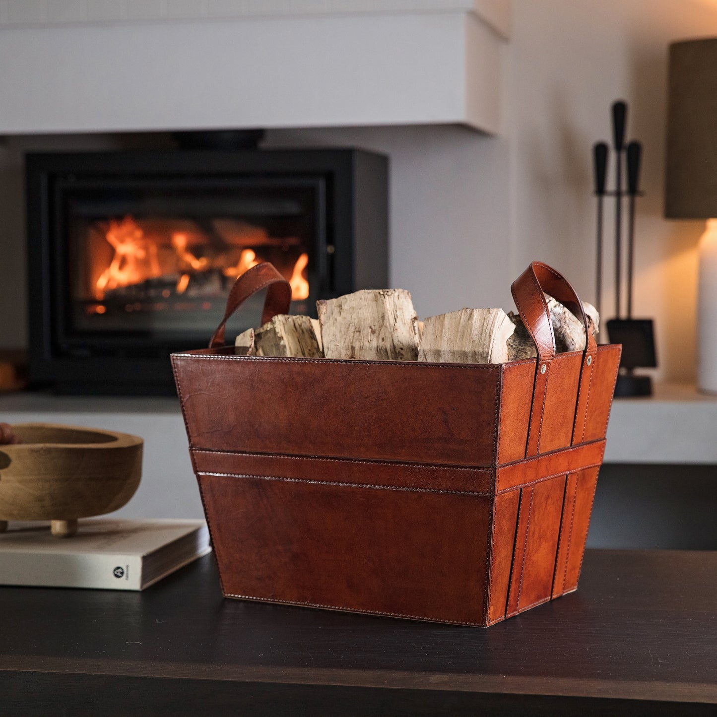Sturdy rectangular tan leather log basket with handles. Ideal for carrying and storing logs and kindling. Personalise for a thoughtful retirement gift.