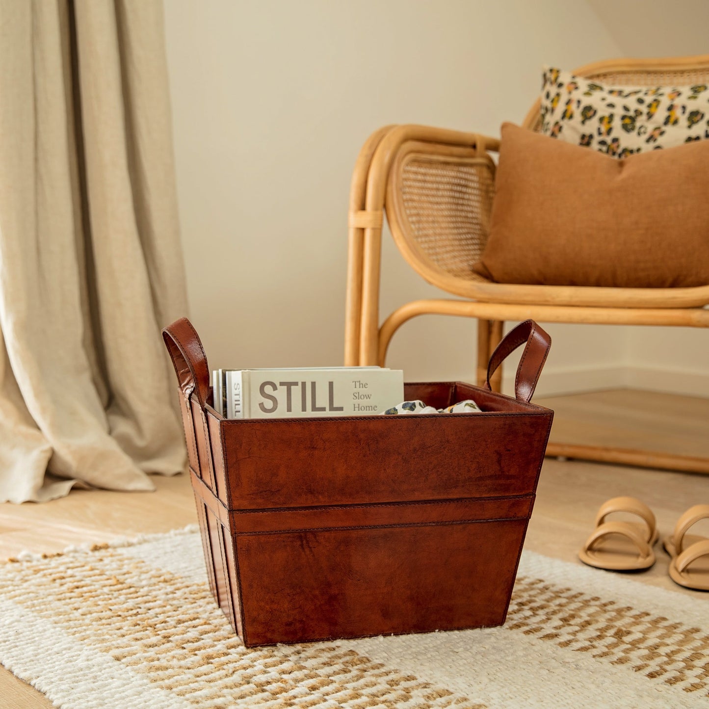 Sturdy rectangular tan leather magazine basket with handles. Ideal for storing magazines or newspapers, add a personalised tag for a thoughtful 60th birthday gift.