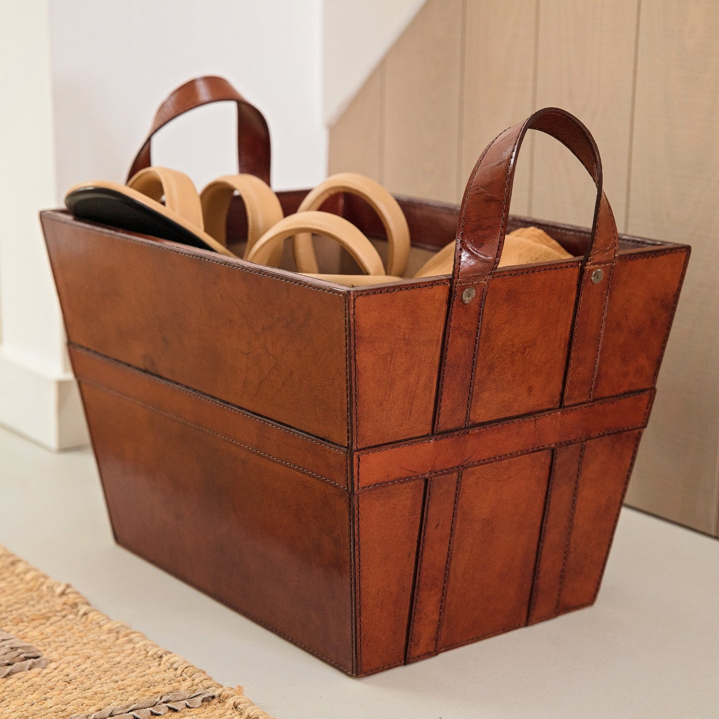 Sturdy rectangular tan leather magazine basket with handles. Ideal for storing magazines or newspapers, add a personalised tag for a thoughtful 60th birthday gift.