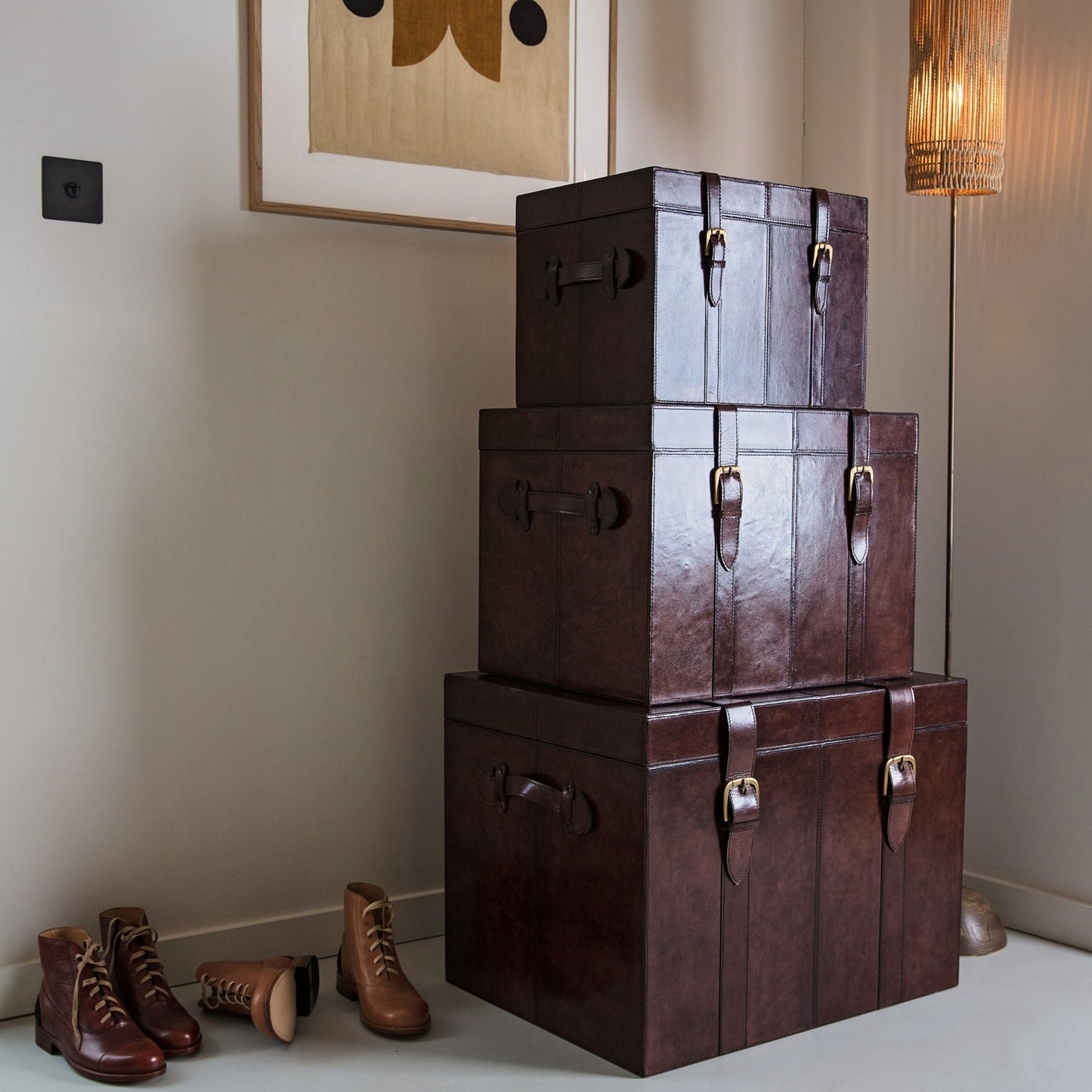 Set of rich brown leather storage trunks in three sizes with lids and buckles. A timeless heirloom gift for the home or a wedding day gift to treasure forever.