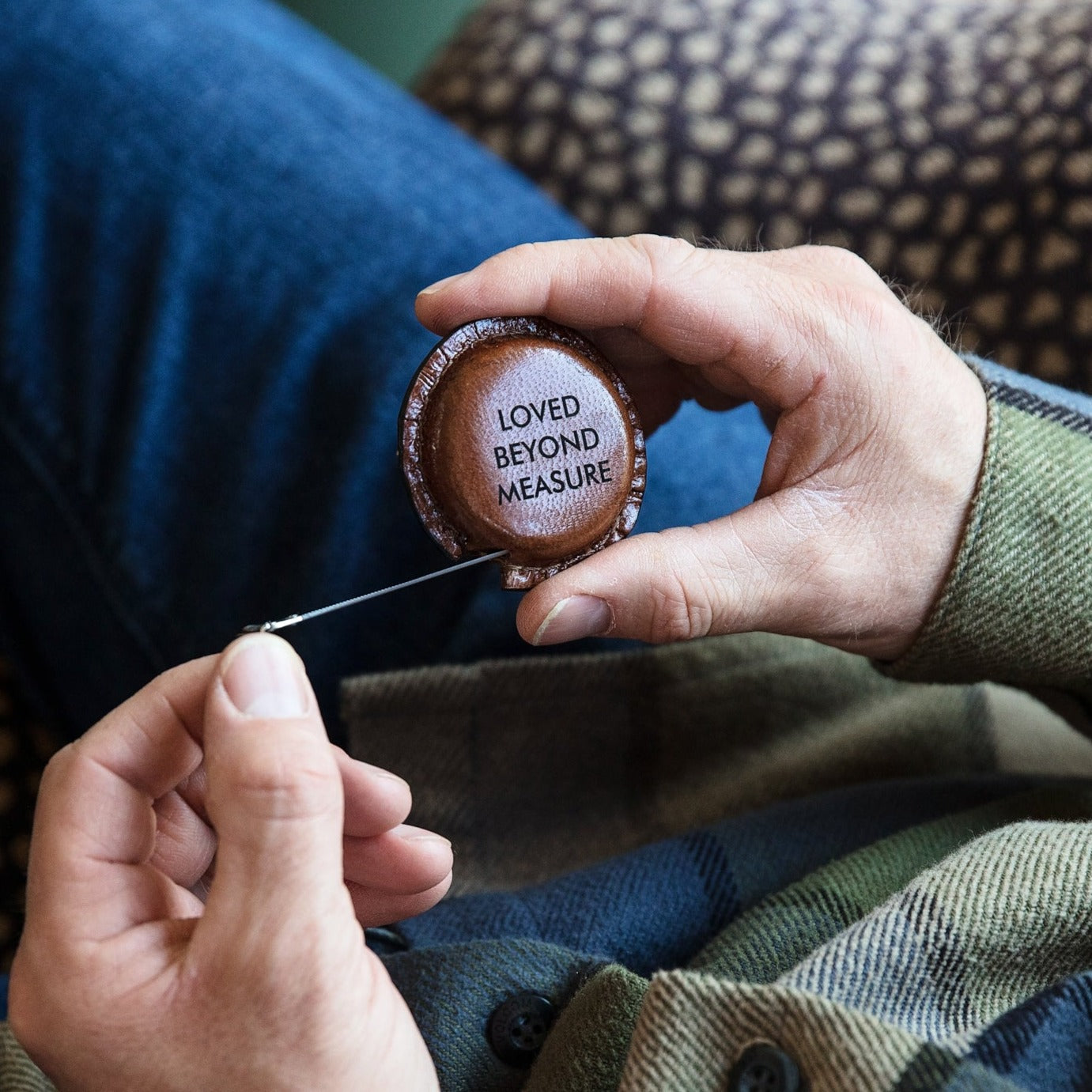 
                  
                    Timeless tan leather pocket sized tape measure. Add a decorative initial for a thoughtful leather anniversary gift.
                  
                