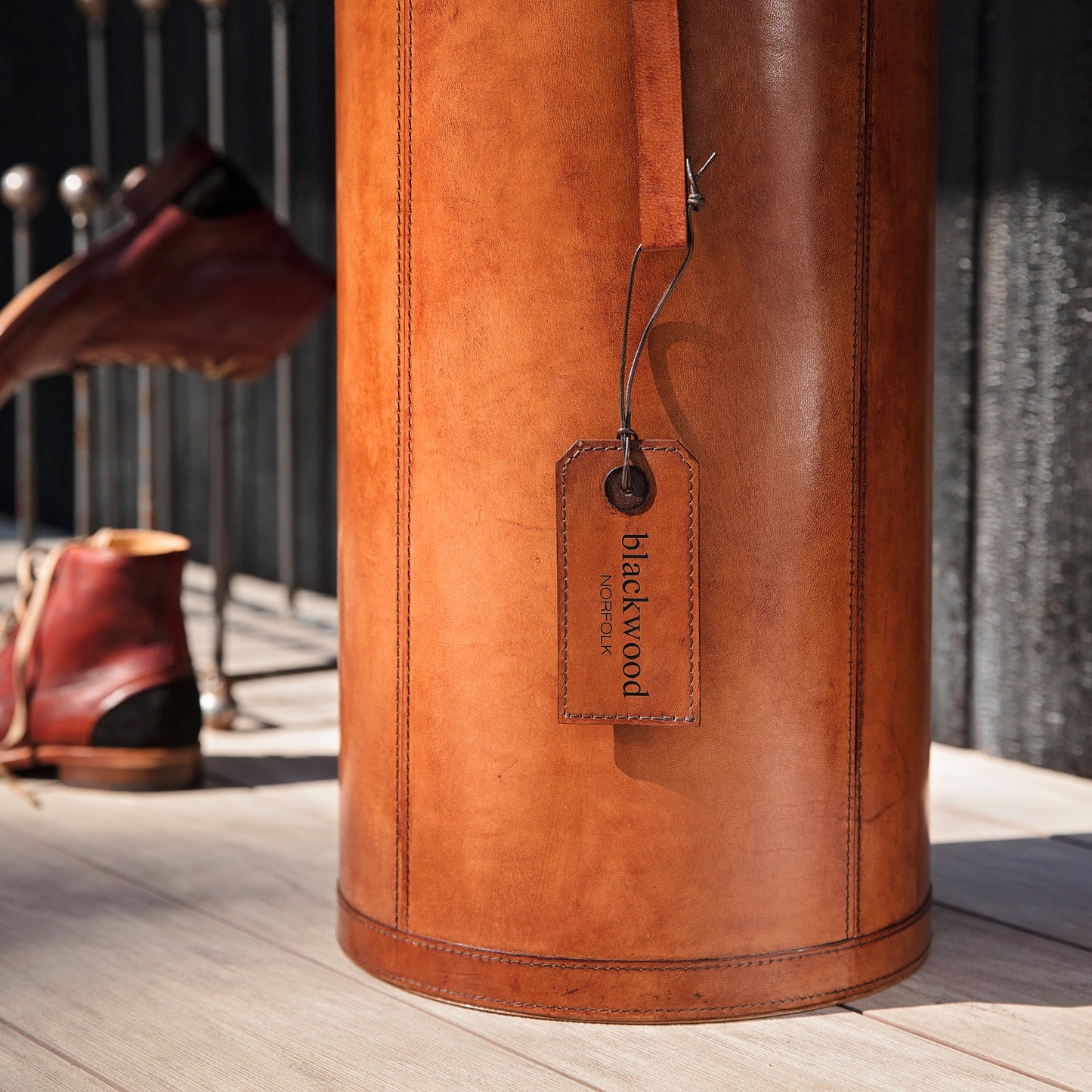 Classic cylindrical shaped tan leather umbrella stand with removable drip tray and carrying handles. Sturdy and timeless, add a personalised leather tag for a special birthday gift.