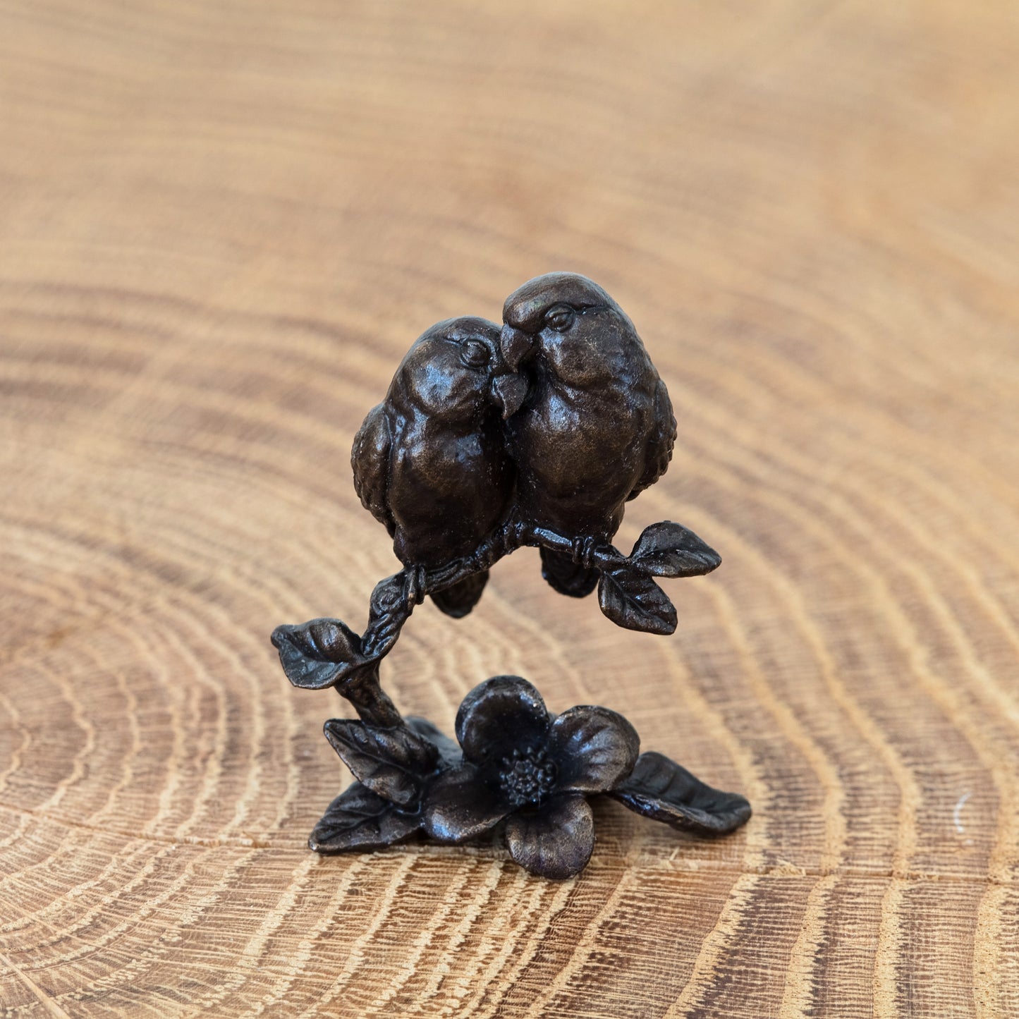 A miniature bronze sculpture of a pair of lovebirds finished with a traditional patina. Ideal as a 3rd wedding anniversary gift for a loving couple.