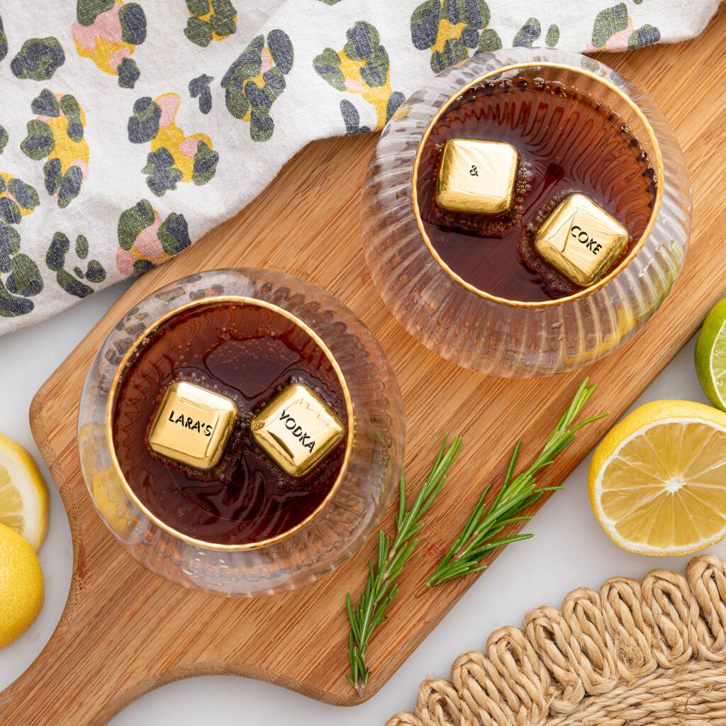 Set of four personalised gold finish stainless steel ice cubes. Add initials, names or dates to create a thoughtful Mother’s Day or Christmas gift.