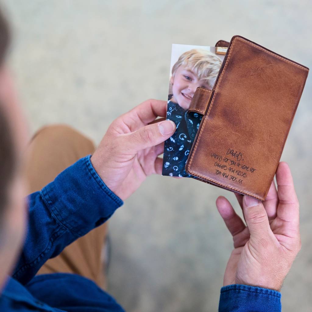 
                  
                     Leather travel photo frame that holds two 6 x 4 photos of loved ones. Add a name or short message inside and out for a thoughtful first father’s day gift.
                  
                