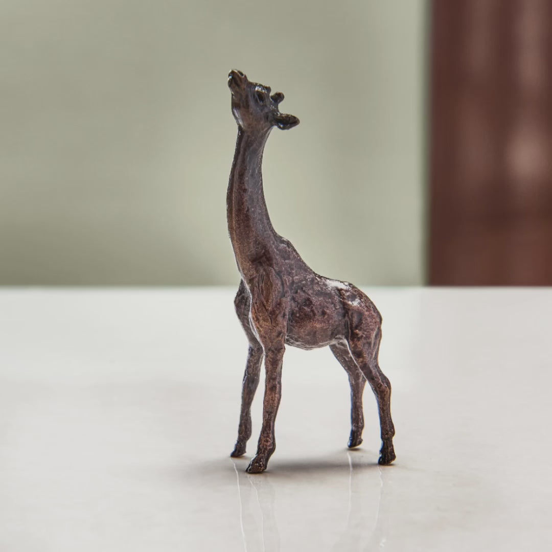 Load and play video in Gallery viewer, Miniature bronze figurine of a giraffe. Give as a bronze anniversary gift or thoughtful birthday gift.