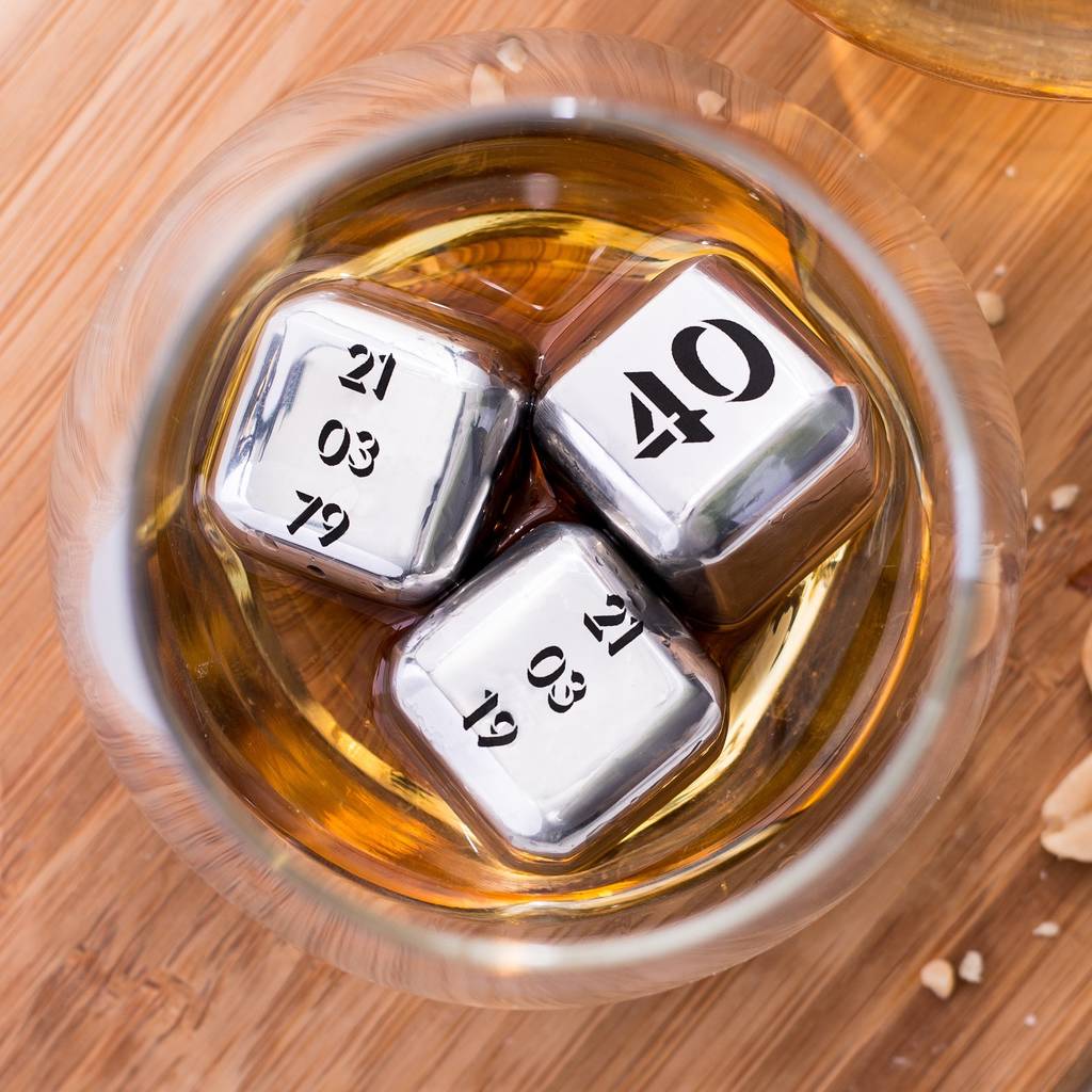 Set of four personalised stainless steel ice cubes. Add initials, names or a fun message as a unique milestone birthday gift.