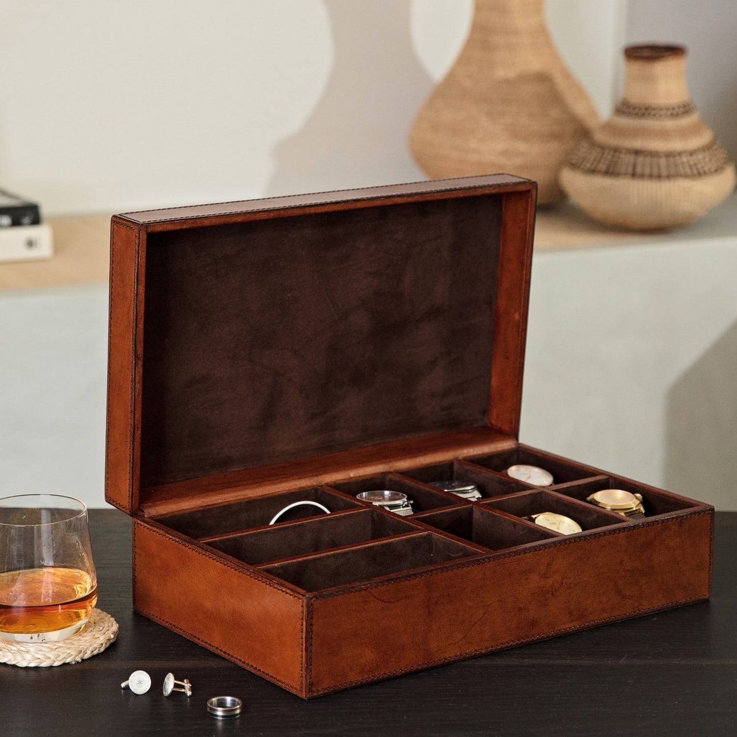 Alt image text: Rectangular men’s storage box in tan leather lined with micro suede. With six watch compartments with removable watch pillows and three sections for accessories. Personalise with a name or date as a unique new home or anniversary gift.