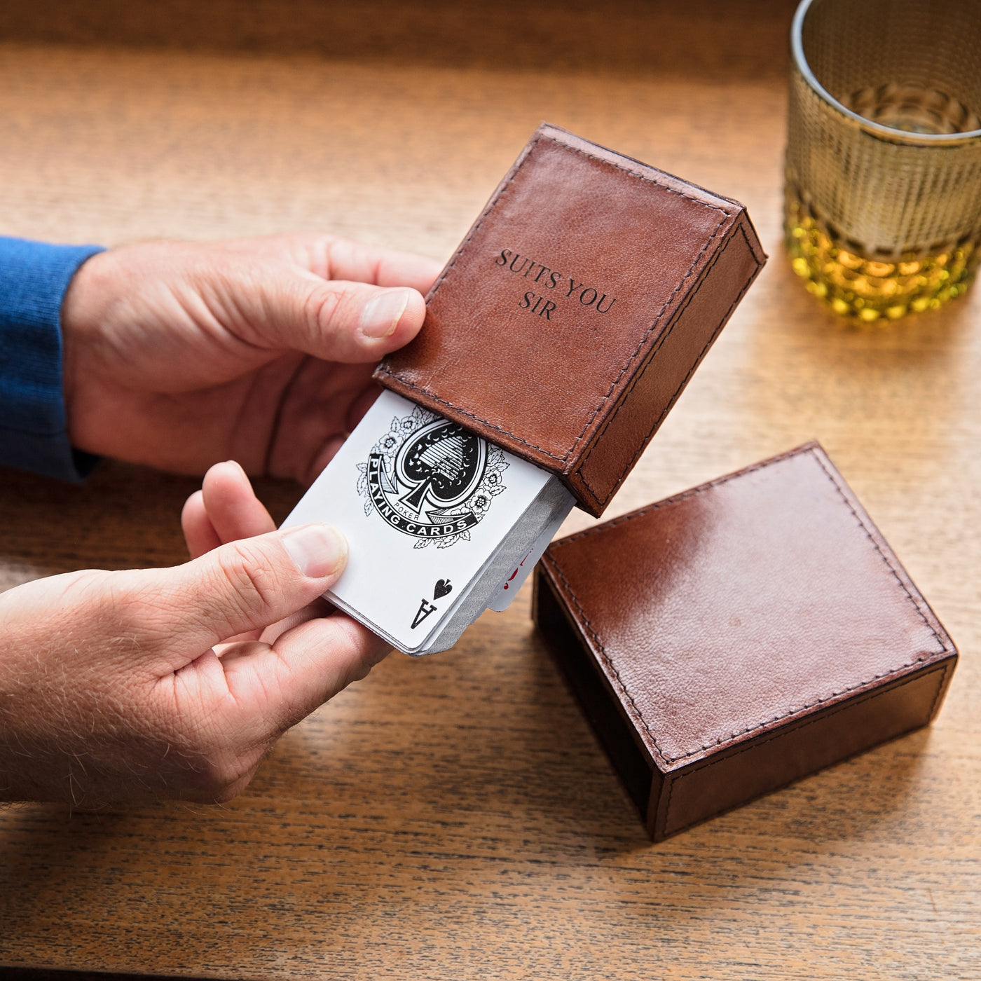 Playing card case made from soft tan leather to hold a single deck of 52 cards. Personalise with a message or name inside and out for a thoughtful birthday gift for him.