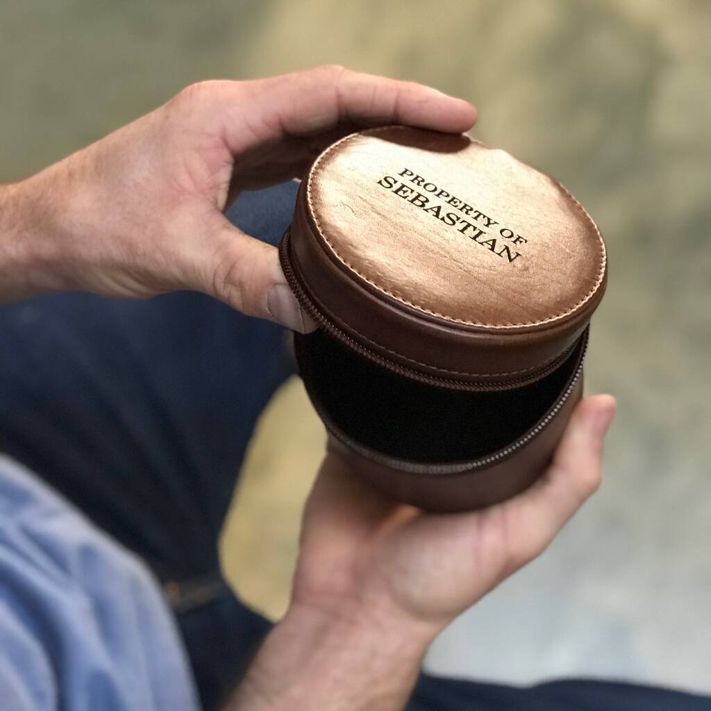 Round jewellery travel casein soft tan leather with zip closure. Ideal for storing jewellery whilst travelling or at home. Personalise with a name or date as a thoughtful anniversary or birthday gift.