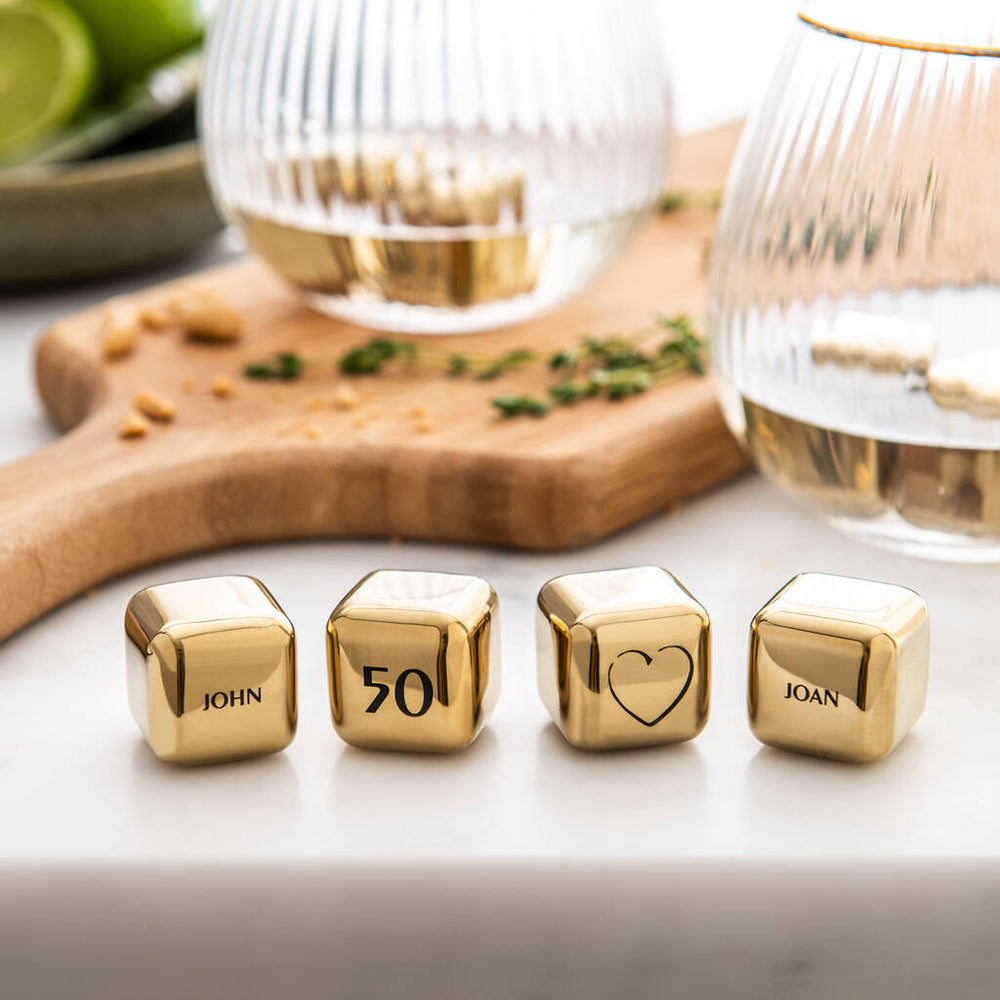 
                  
                    Set of four personalised gold finish stainless steel ice cubes. Add initials, names or dates to create a thoughtful golden wedding anniversary gift.
                  
                