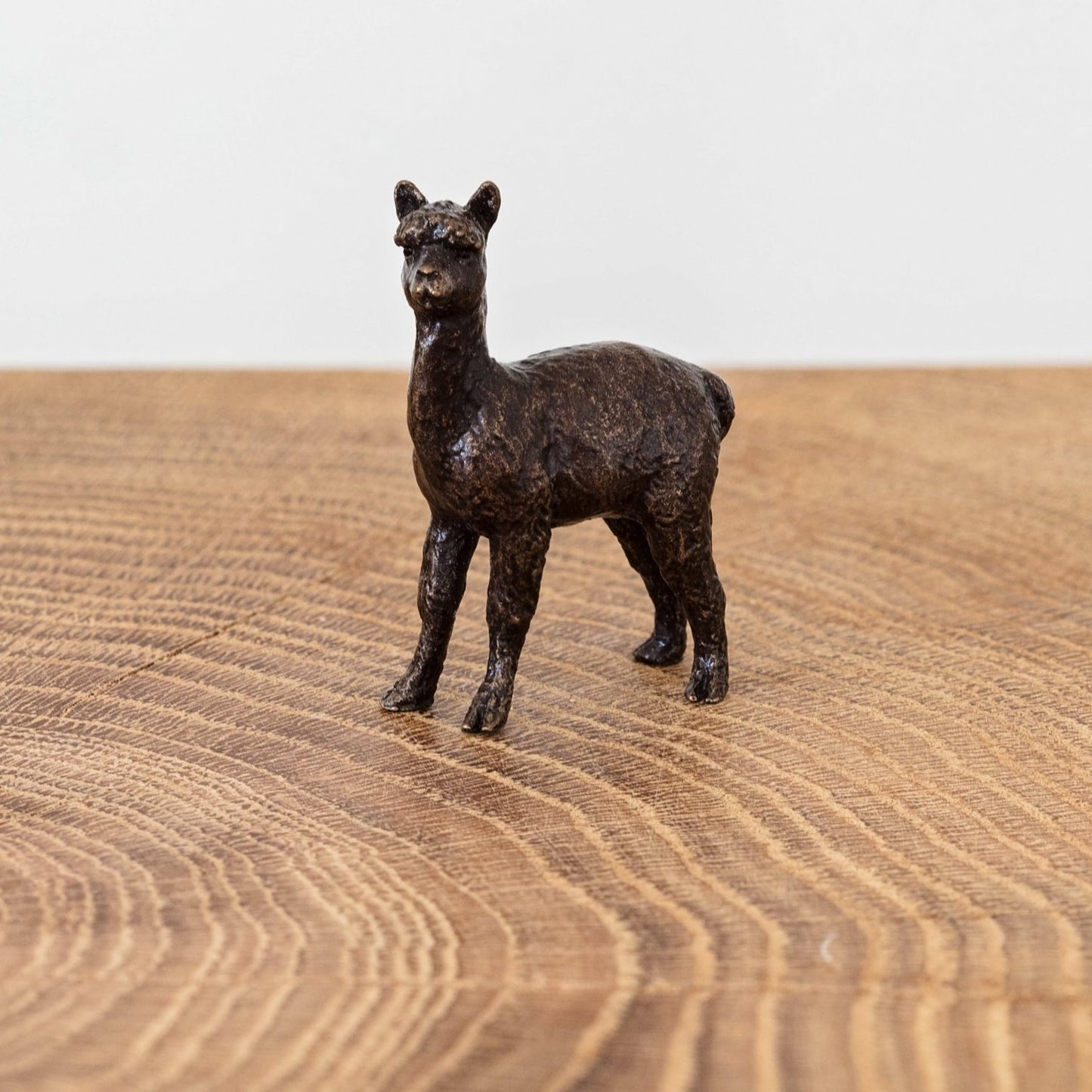 A miniature bronze alpaca figurine that makes an ideal 3rd wedding anniversary gift or good luck gift for a travelling friend.