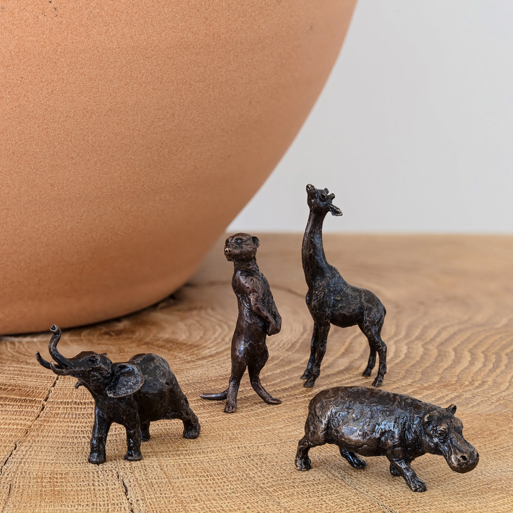 Gift set of miniature bronze figurines from the African plains, including a hippo, elephant, giraffe and meerkat. Ideal as a thoughtful wedding or bronze anniversary gift for an animal loving couple.