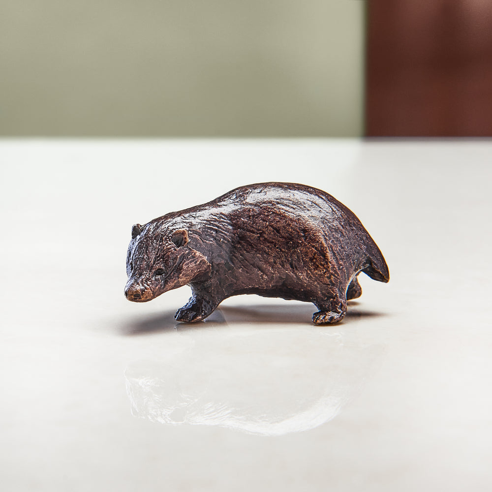 Miniature bronze figurine of a badger. Ideal as a bronze anniversary gift or thoughtful birthday gift.