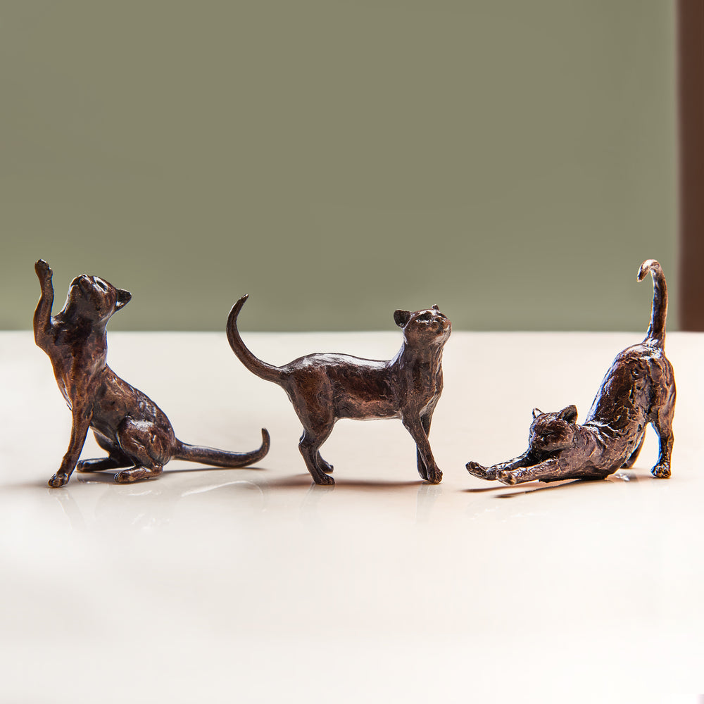 Gift set of three miniature bronze cat figurines stretching, sitting and standing. Ideal as a thoughtful birthday or bronze anniversary gift.
