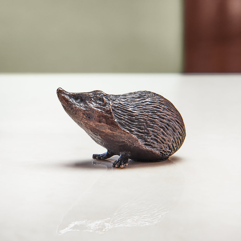 Miniature bronze figurine of a hedgehog. Ideal as a bronze anniversary gift or thoughtful birthday gift.