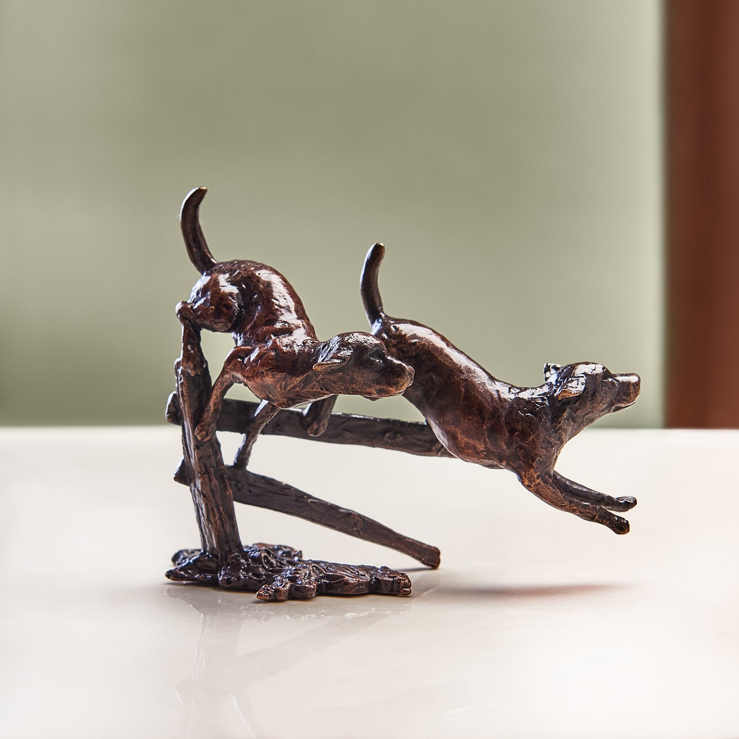 Miniature bronze figurine of two eagerly running labradors in the great outdoors. Ideal as a thoughtful birthday or bronze anniversary gift.