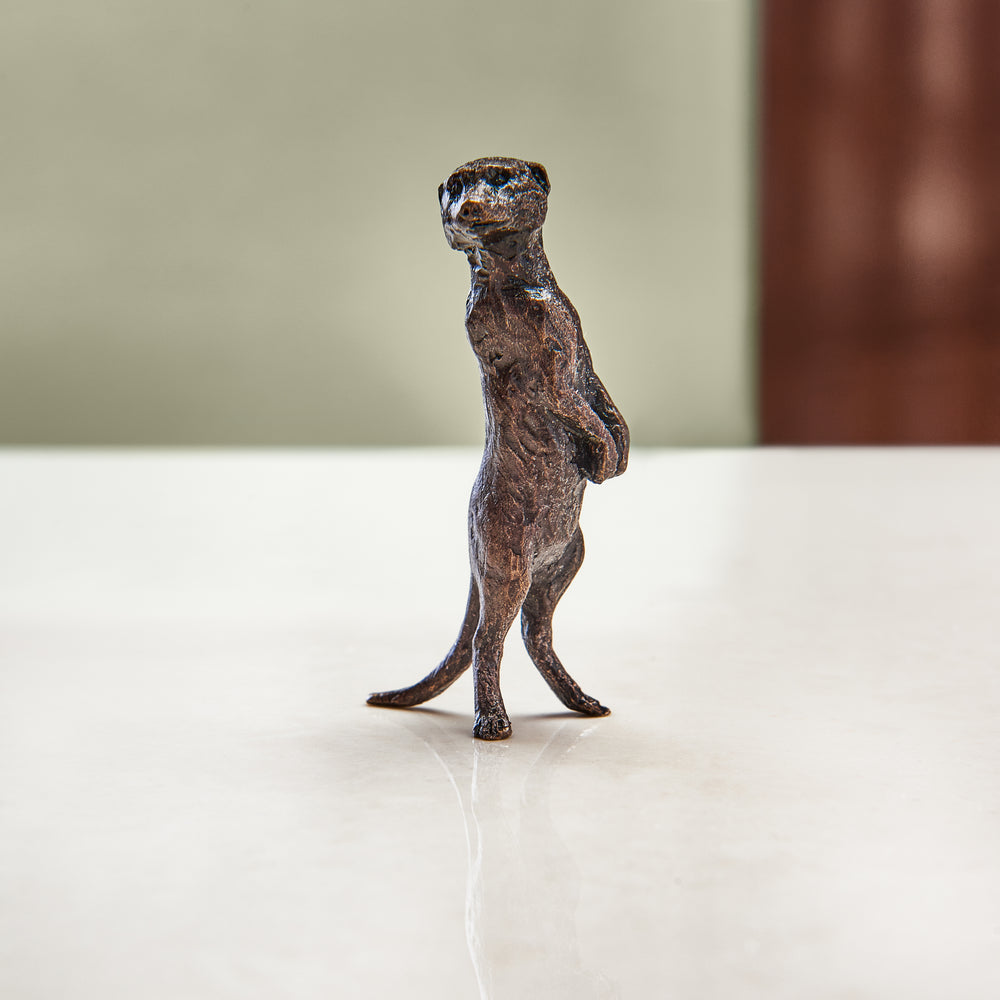 Miniature bronze figurine of a meerkat. Give as a bronze anniversary gift or thoughtful birthday gift.