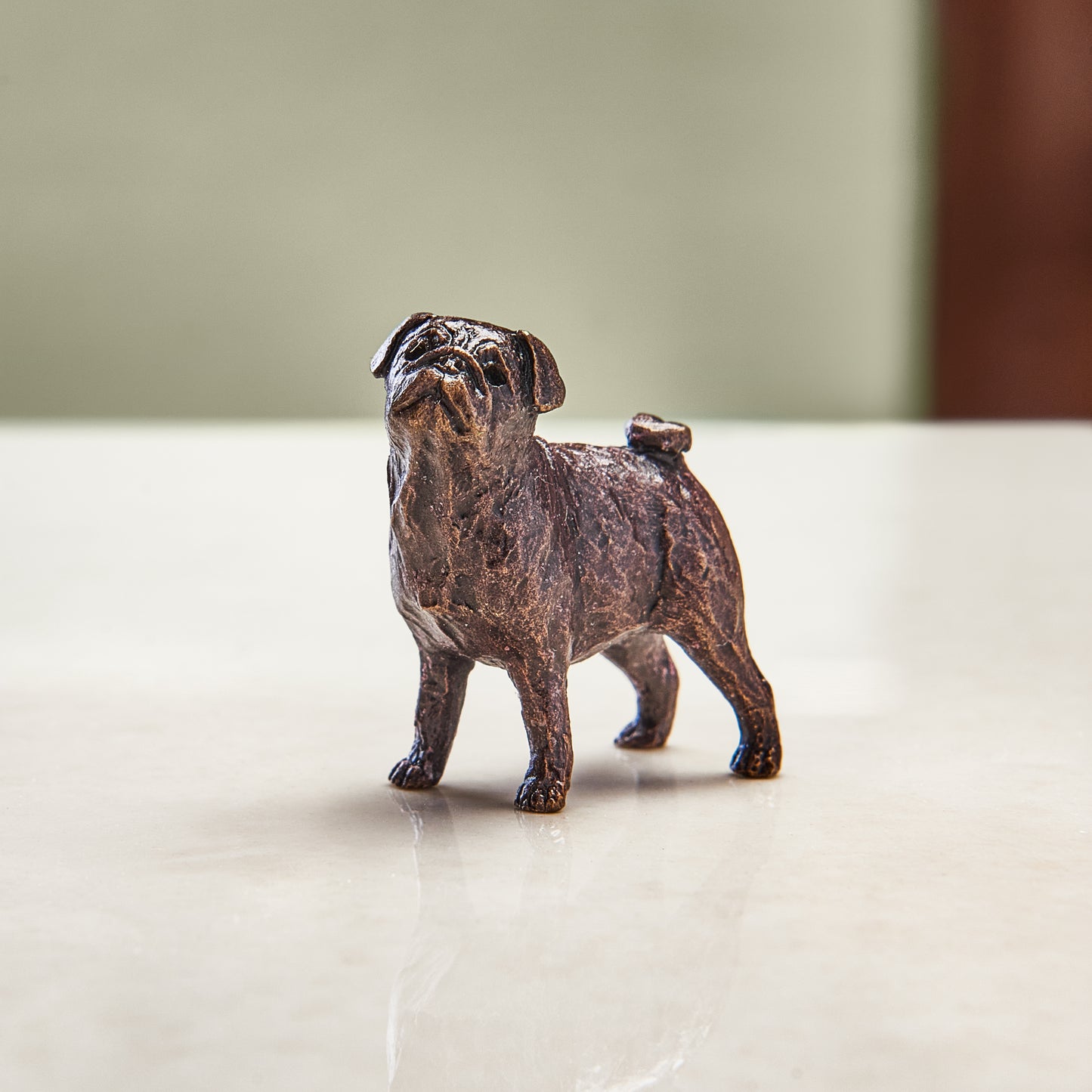 
                  
                    Miniature bronze figurine of a pug. A thoughtful bronze anniversary gift for him or her.
                  
                