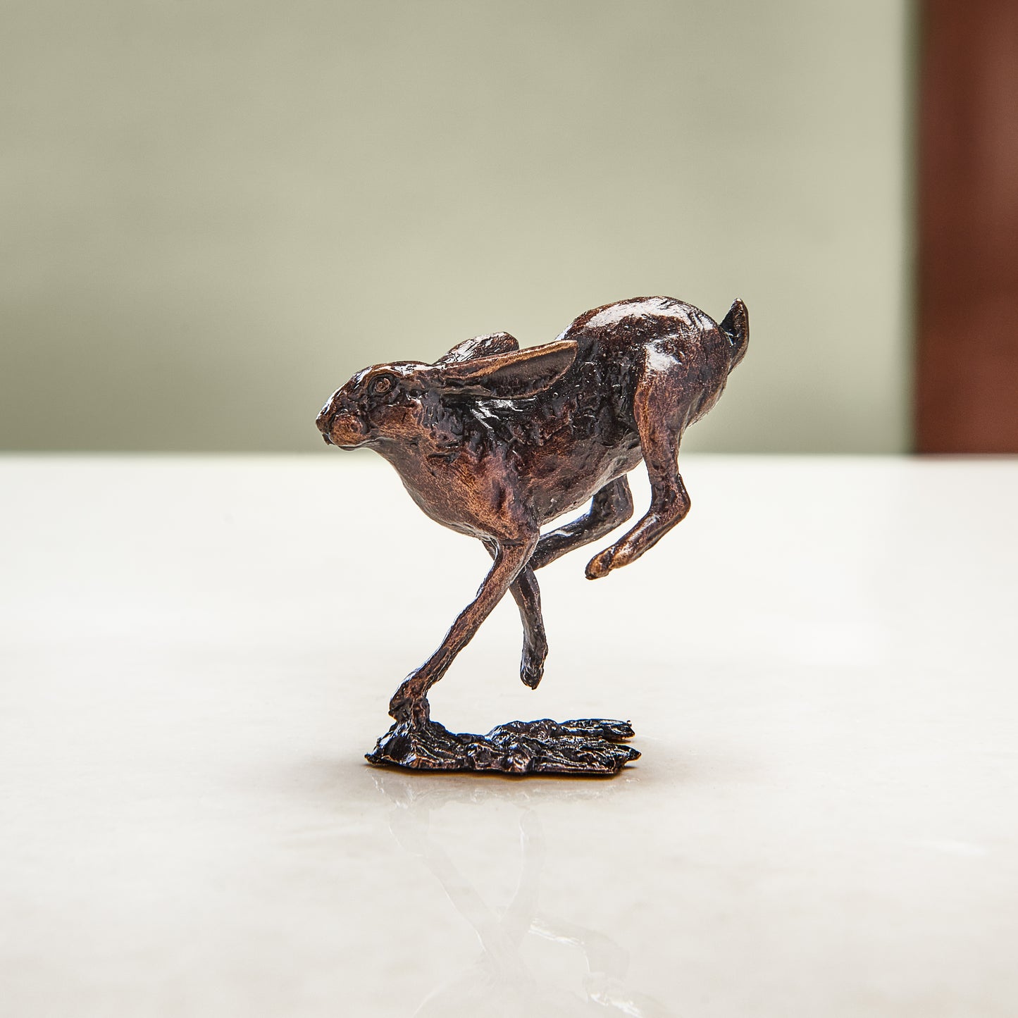 
                  
                     Miniature bronze figurine of a running hare. Give as a bronze anniversary gift or thoughtful birthday gift.
                  
                