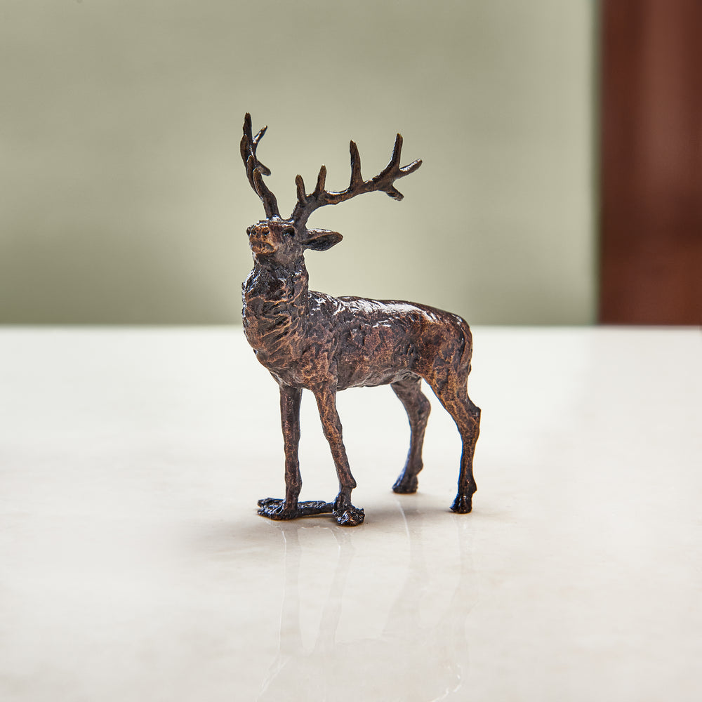 Miniature bronze stag figurine to give as a bronze anniversary gift or decorative home accessory.