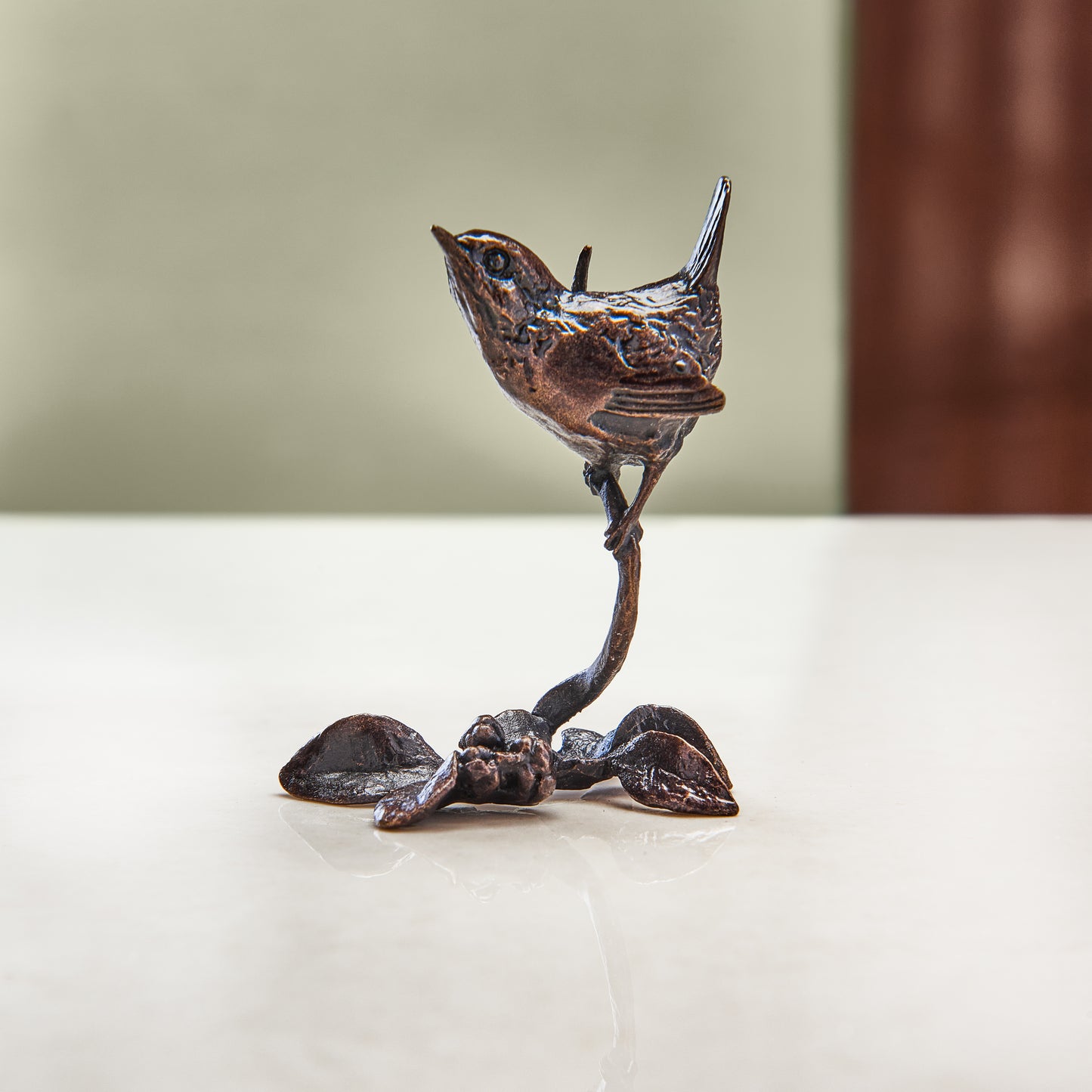 Miniature bronze figurine of a wren perched on a branch. A perfect bronze anniversary gift.