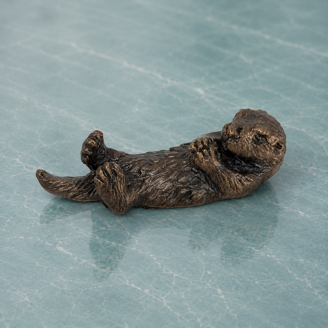 
                  
                    Miniature bronze sea otter sculpture, the perfect gift bronze anniversary gift for those celebrating their 8th wedding anniversary.
                  
                