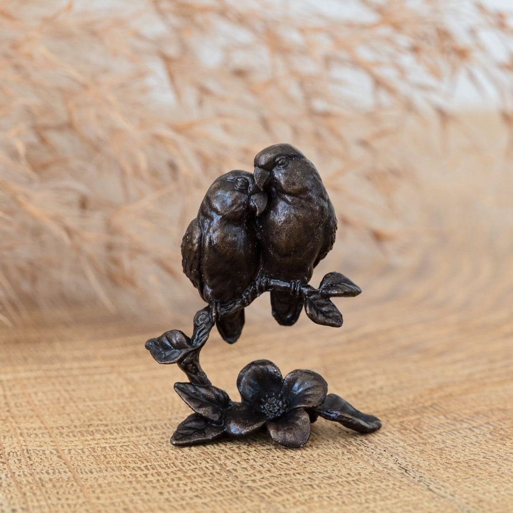 A miniature bronze sculpture of a pair of lovebirds finished with a traditional patina. Ideal as a 3rd wedding anniversary gift for a loving couple.