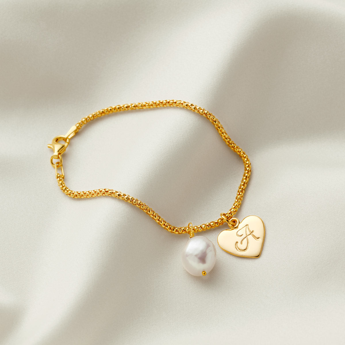 
                  
                    Gold Heart Initial Bracelet With Pearl Charm
                  
                