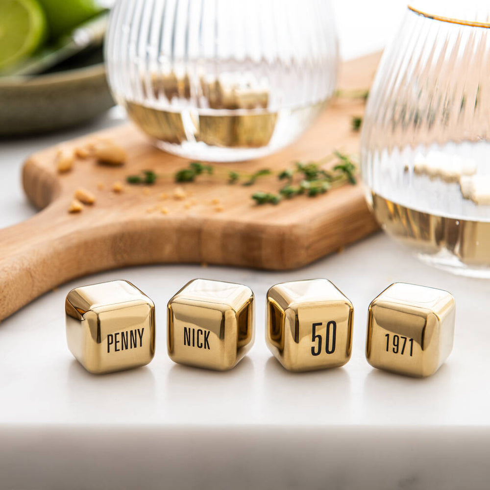 
                  
                    Set of four personalised gold finish stainless steel ice cubes. Add initials, names or dates to create a thoughtful golden wedding anniversary gift.
                  
                