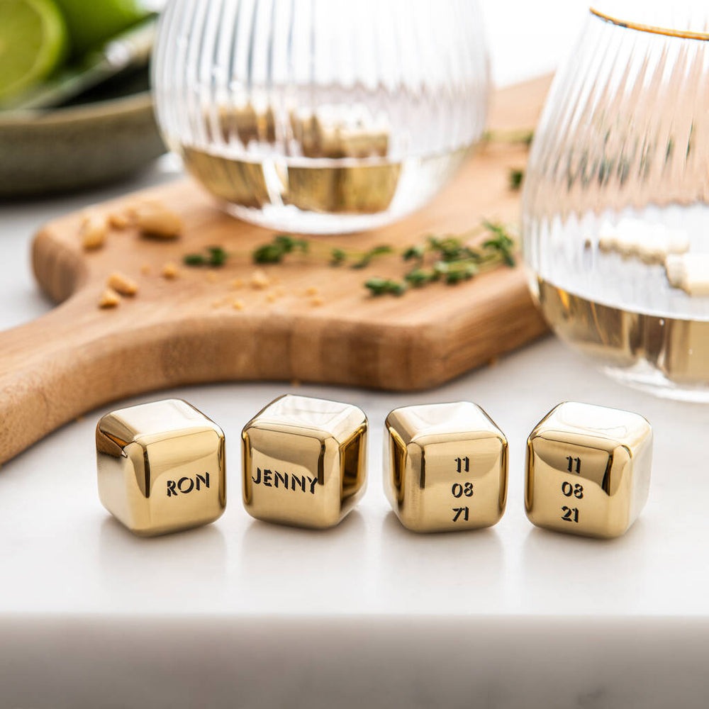 
                  
                    Set of four personalised gold finish stainless steel ice cubes. Add initials, names or dates to create a thoughtful golden wedding anniversary gift.
                  
                