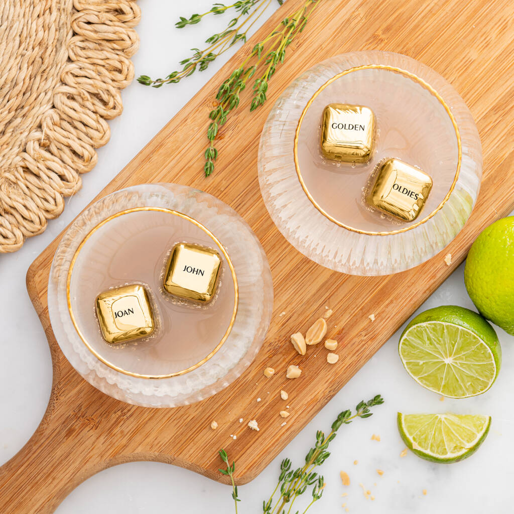 
                  
                    Set of four personalised gold finish stainless steel ice cubes. Add initials, names or dates to create a thoughtful golden wedding anniversary gift.
                  
                